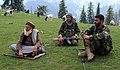 ANA soldiers socializing with an Afghan shepherd