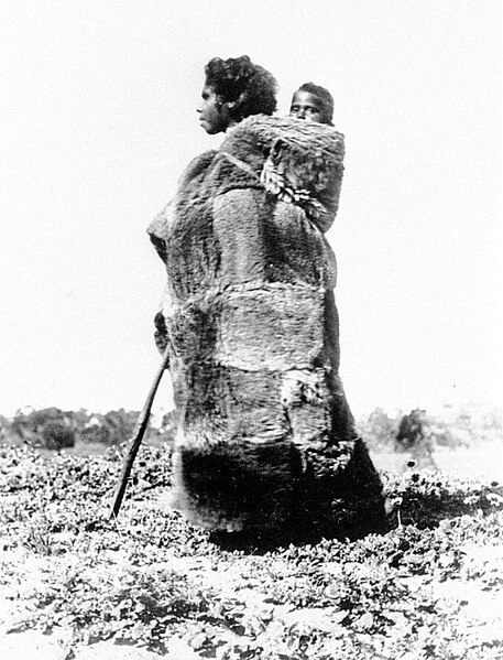 File:Aboriginal woman in a kangaroo skin cloak carrying a child, South Australia, ca. 1860.jpg