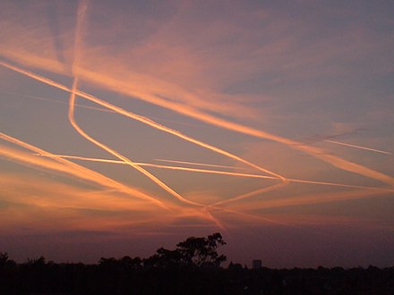 Intersecting contrails of aircraft over London, an area of high air traffic