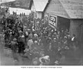 Alaska Governor JFA Strong and crowd disembark from ship at the City Dock, Juneau, ca 1914 (CURTIS 1866).jpeg