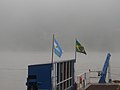 Banderas argentina y brasileira en balsa en Rio Uruguay (Alba Posse - Porto Mauá).jpg