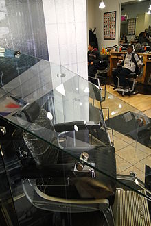 Barack Obama's bulletproof glass-encased barber chair at Hyde Park Hair Salon in Chicago Barack Obama's Bulletproof Glass-Encased Barber Chair - Hyde Park Hair Salon - 5234 S. Blackstone Ave. - Chicago - Illinois - USA.jpg