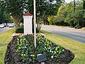 A post topped with Spanish tile that shows 1907, the year before the Handbook of Texas states that Baldwin founded Bellaire