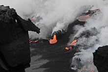 Black sand forming when lava hits ocean. Kilauea volcano. Black Sand Forming.jpg