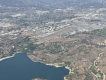 A view of Brackett Field, Puddingstone Reservoir, and the Los Angeles County Fairgrounds; University of La Verne can also be seen.