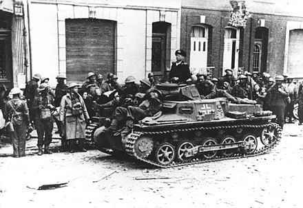 British prisoners of war with a Pz.Kpfw Ib German tank in Calais in May, 1940