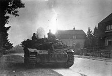 Assault gun parked at the side of the street with houses across the road