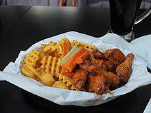 Tampere claims to be the "wings capital of Finland", consuming almost half of the hot wings in Finland. The restaurant chain Siipiweikot originates from Tampere. Almost half of the chicken wings sold in Finland are eaten exclusively in Pirkanmaa. Chicken wings meal at Siipiweikot.jpg