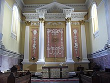 The altar, with the Tetragrammaton above. Church high altar.jpg