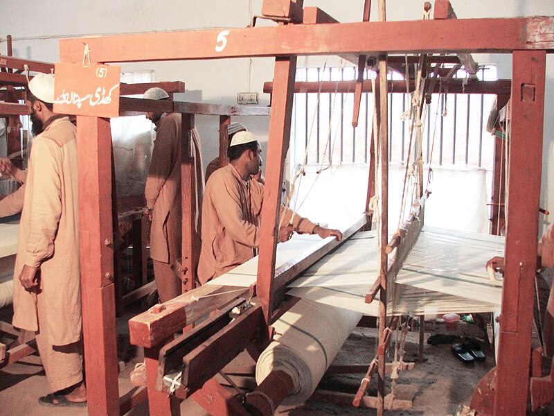 File:Correctional Activities at Central Jail Faisalabad, Pakistan in 2010 - Convict weaver busy in weaving a Hospital Bed Sheet on a traditional manual loom.jpg