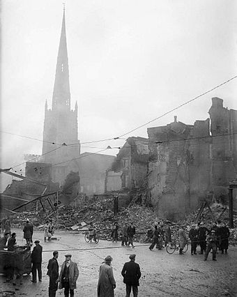 The Holy Trinity Church rises above a scene of devastation.