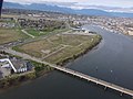 North-facing aerial view of Dinsmore Bridge in Richmond, British Columbia connecting Lulu Island with Sea Island