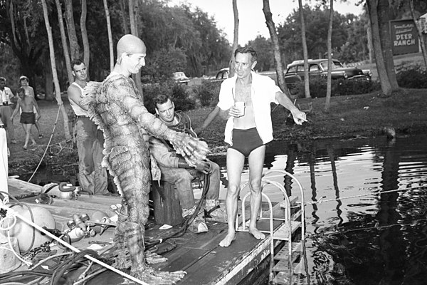 Arnold (right) and Ricou Browning with crew on the set of 1955's Revenge of the Creature