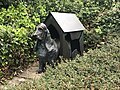 Dog in a kennel sculpture.jpg