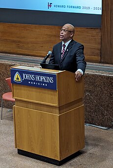Dr. Quinn Capers IV speaking at Johns Hopkins Hospital.jpg