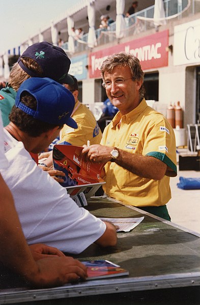 Eddie Jordan, founder and owner of Jordan Grand Prix, greets the fans in Montreal in 1996.