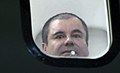 El Chapo looks out window of airplane (DEA photo).jpg