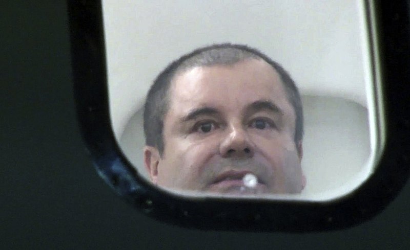 File:El Chapo looks out window of airplane (DEA photo).jpg