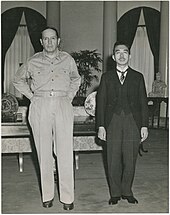 Gaetano Faillace's famous photo of Douglas MacArthur and Emperor Hirohito Emperor Hirohito and General MacArthur.jpg