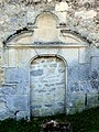 Porte bouchée à l'ouest du bas-côté sud.