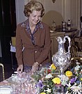 Ford reviews the table settings while preparing for the September 21, 1976 state dinner in honor of Liberian President William Tolbert