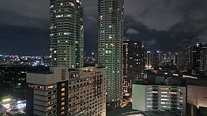 Holiday Inn Manila (foreground) with Park Terraces, Makati Fairmont Hotel, and Raffles Makati on the background