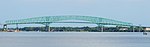 The Hart Bridge spanning the St. Johns River in Jacksonville, Florida, is a continuous, cantilevered truss bridge which combines a suspended road deck on the 332-metre (1,088 ft) main span and through truss decks on the adjacent approach spans