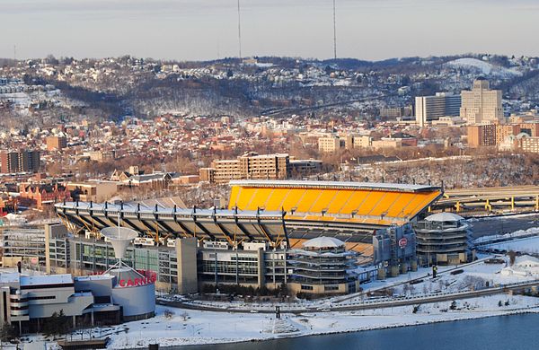 Heinz Field on the North Shore, with the Ohio River visible in the foreground and the Kamin Science Center to the left.