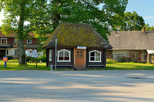 Wooden bus stop shelter in Sõmerpalu Parish, Estonia