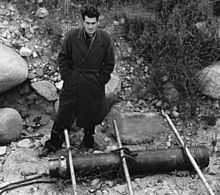 Parsons standing above a JATO canister at JPL June 1943