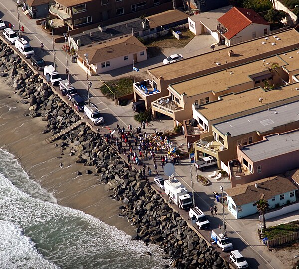 Media and fans at a memorial outside Seau's house the day after his suicide