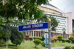 Street sign showing Jalan Stadium with the National Stadium (Stadium Negara) in the background. Kuala Lumpur Malaysia Stadium-Negara-11.jpg