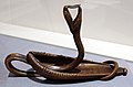 Louis majorelle, candelabro serpente in una foglia arricciata, bronzo 1900 ca.jpg