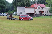 Čeština: Příjezd hasičských vozidel při oslavě 150 let lužeckého hasičského sboru.