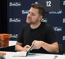 Manson signing his book Everything Is F*cked at BookCon 2019 Mark Manson at BookCon (16212).jpg