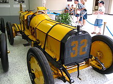 Ray Harroun's Marmon "Wasp" with its rear-view mirror mounted on struts above the car on display in the Indianapolis Motor Speedway Hall of Fame Museum. MarmonWasp.JPG