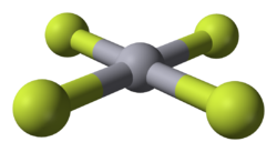 central gray sphere with 4 others attached by spokes in a plane, 90 degrees apart