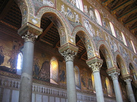 The walls of the clerestory of the basilica-shaped cathedral of Monreale, Italy are covered with mosaic