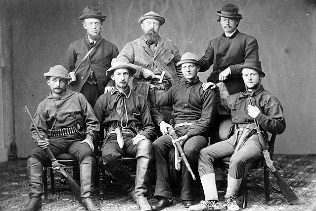 Marsh (back row and center), surrounded by armed assistants for his 1872 expedition. Marsh spent little time in the field himself, generally delegatin