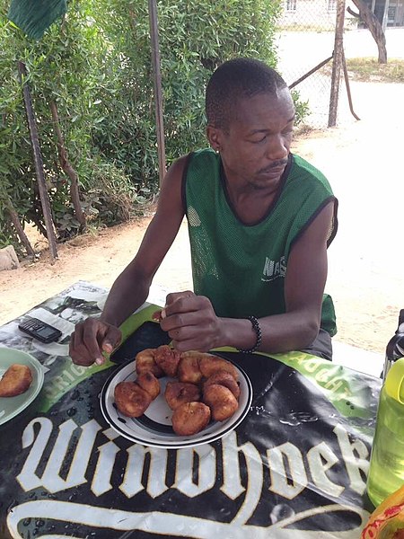 File:Okakarara Man Eating Fat Cakes.jpg