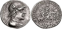 Silver coin of Plato Epiphanes wearing a crested Bactrian helmet adorned with bull's horn and ear.