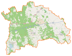 Mapa konturowa powiatu nowotomyskiego, blisko prawej krawiędzi na dole znajduje się punkt z opisem „Dakowy Mokre”