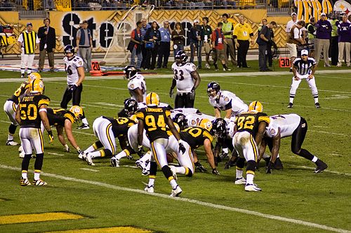 Flacco (crouching) lines up against the Pittsburgh Steelers in 2008.
