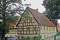 Residential stable house, angled side building and barn of a farm