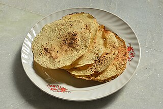 <span class="mw-page-title-main">Papadam</span> Thin, crisp, round flatbread from the Indian subcontinent