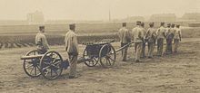 Man-pulled artillery Skoda 70 mm field gun pulled by men (cropped).jpg