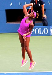 Stephens serving Sloane Stephens serves at the US Open (9662688451) (cropped).jpg