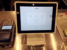 Square Stand at a coffee shop turned around for the customer to choose a tipping option Square Stand POS.jpg