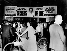 Crowd around an Australian theater showing a sex hygiene film in the 1950s StateLibQld 2 113796 Crowd outside the Paramount Theatre in Bundaberg which was screening a sex education film called 'Secrets of Life', 1950s.jpg