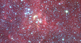 Spitzer image centred on Stephenson 2-SW, with the main cluster towards upper left. The bow-shock feature centered on St2 DFK 49 (seen as a bright yellowish arc) is readily apparent. Stephenson 2-18 and its surroundings.png